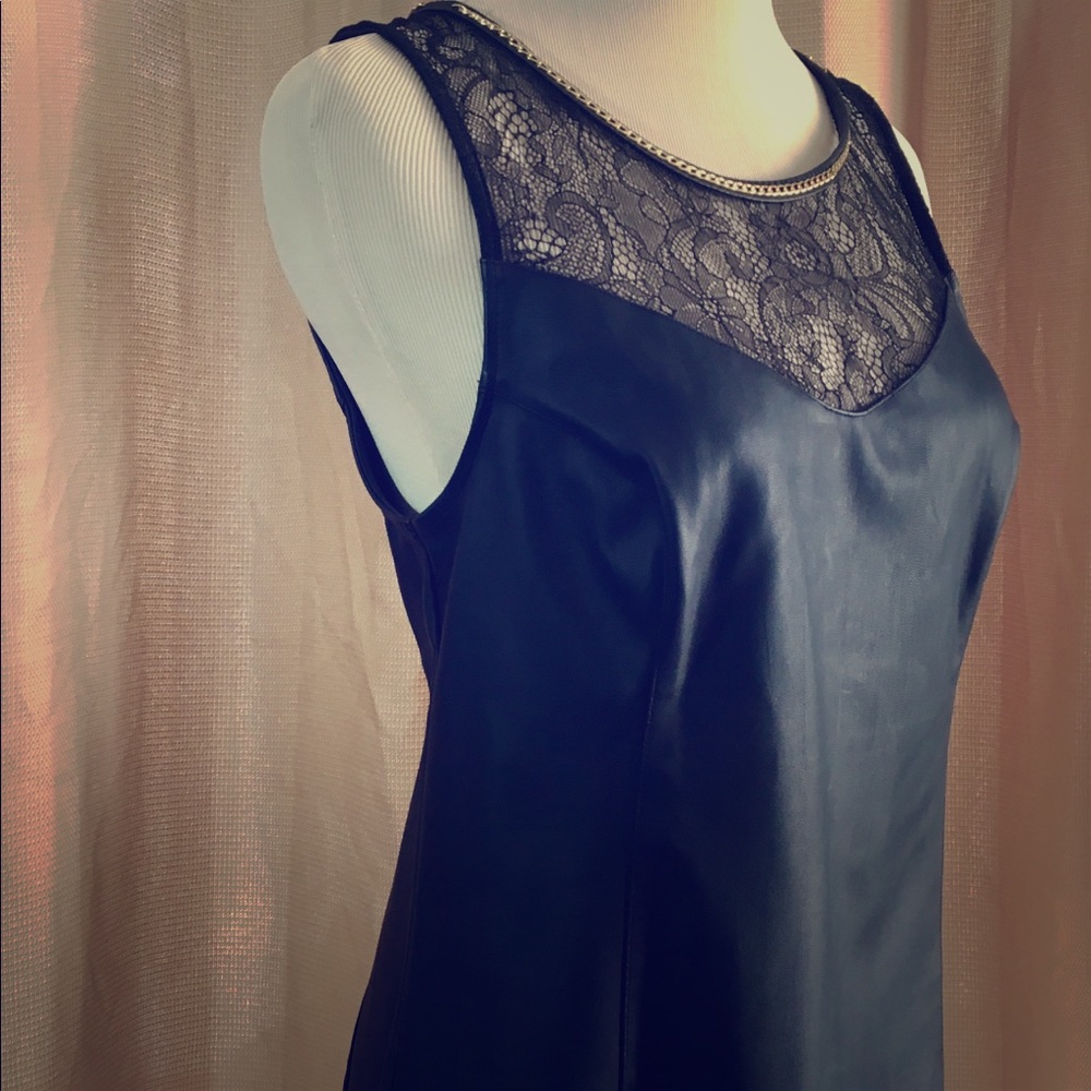Leather like blouse with lace .